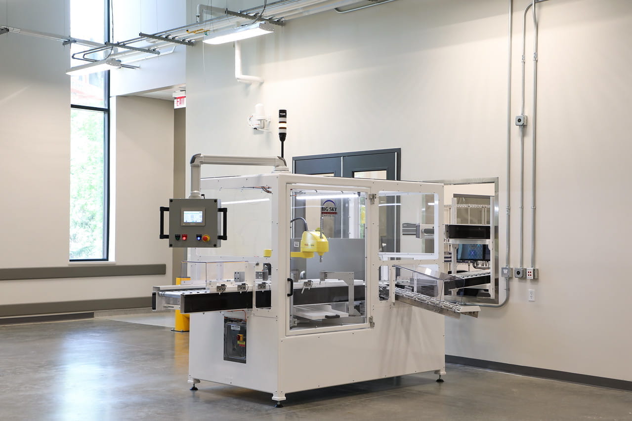 An automated box cutter opens samples returning to the lab.